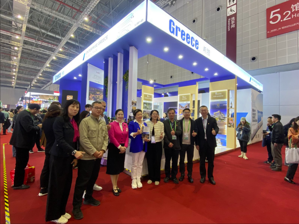 Visitors and partners posing at the Greece Pavilion booth at CIIE in Shanghai, featuring Enterprise Greece and Hellas Group’s “The Best of Greece” showcase.