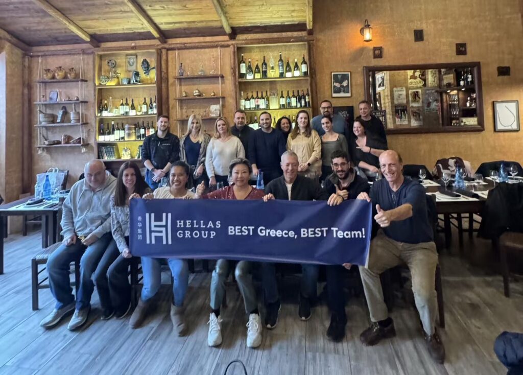 Hellas Group team photo during the Nemea team-building event, holding a “BEST Greece, BEST Team!” banner.